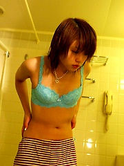 Hitomi Hayasaka Asian teen is disrobing for a hot bath