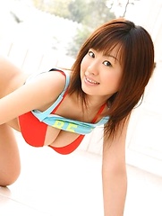 Hitomi Kitamura posing in red bikini her natural breasts.