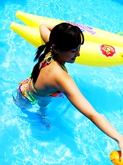 Ayami Sakurai posing in bikinis her big breasts